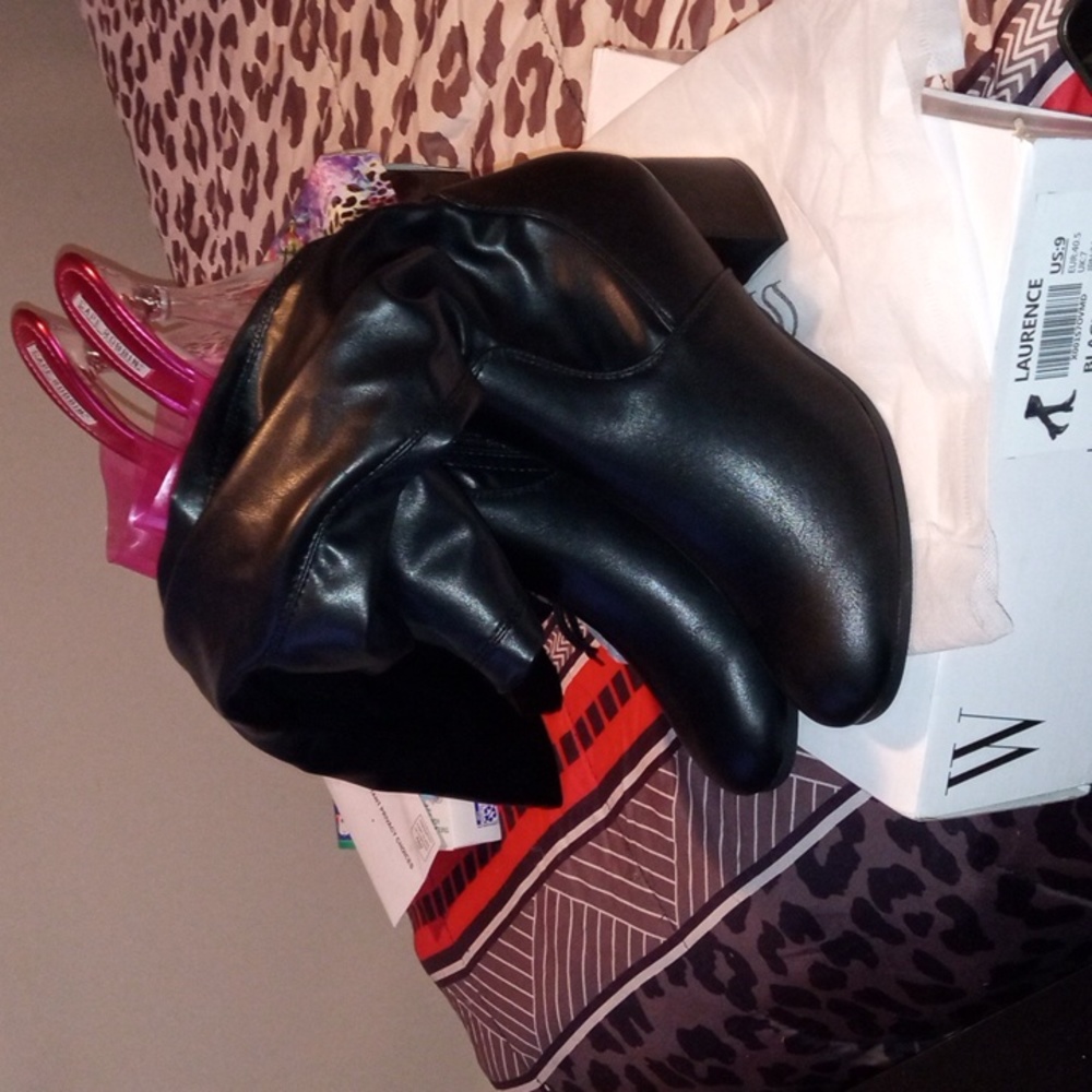 Brand New thigh high leather boots with low heels on them black and size 9